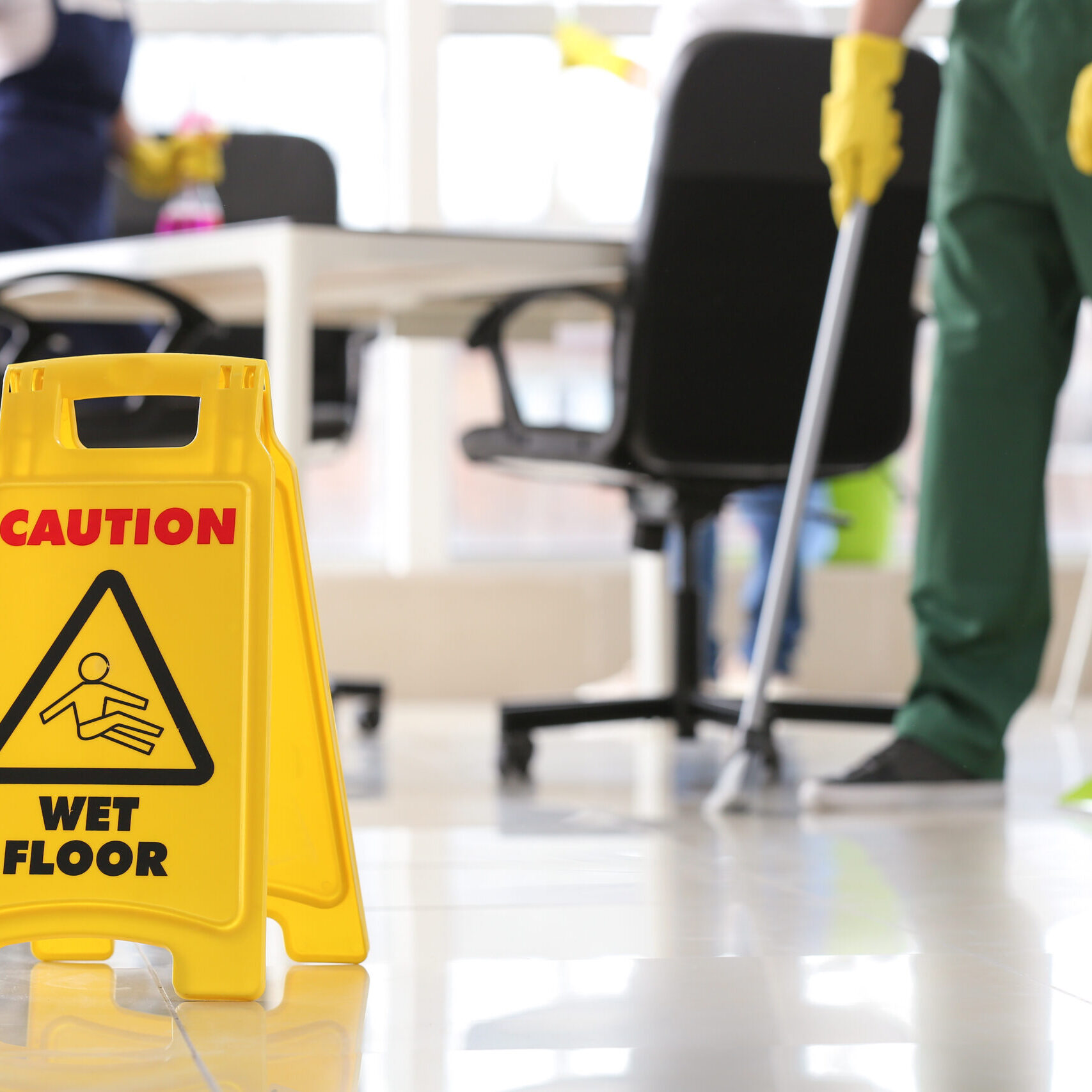Sign board on floor in office during cleaning